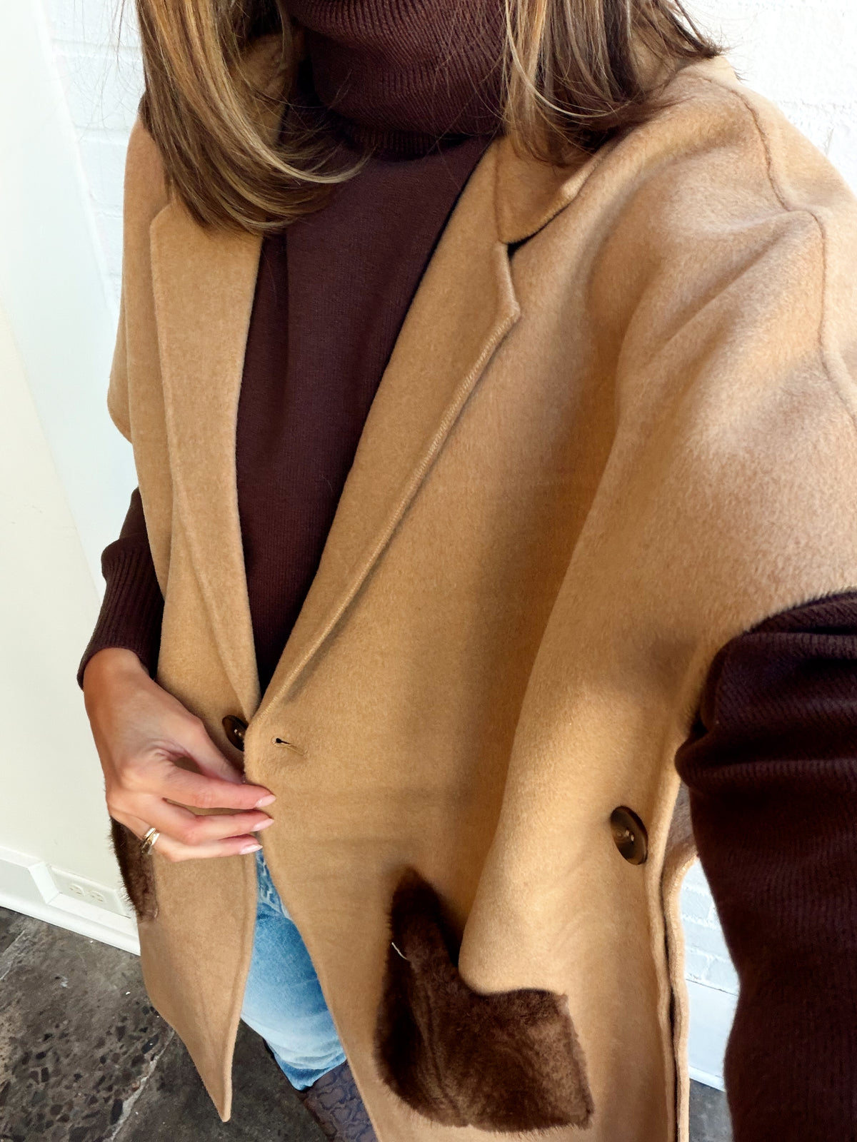 PONCHO WITH FUR POCKETS