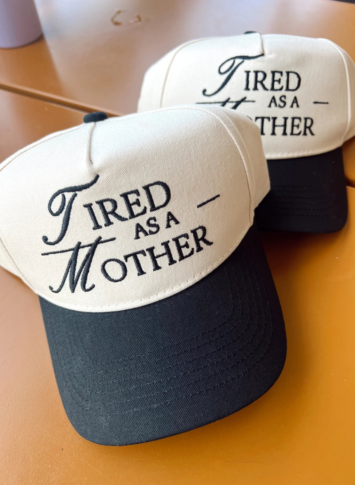 TIRED AS A MOTHER HAT